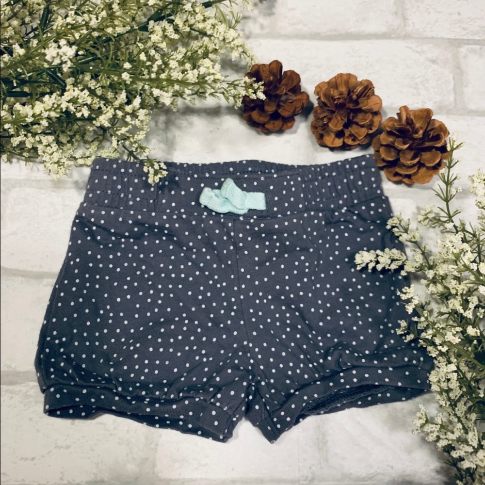 Gray and white polka dot shorts.